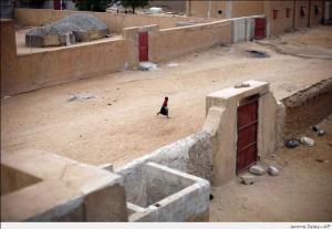 A young child runs through a deserted side street in Gao, northern Mali, on Jan. 28, 2013, the day after French and Malian troops secured a strategic bridge and the airport.